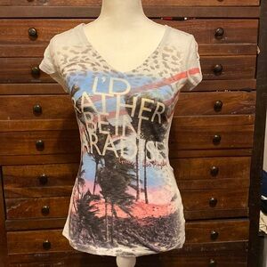 Guess v neck Top says “I’d rather be in paradise” size Medium